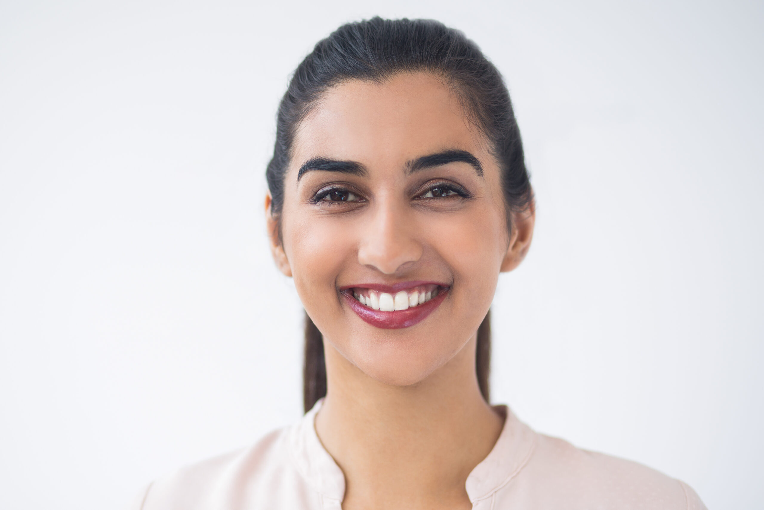 closeup of smiling young beautiful indian woman